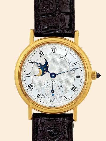 Moon Phase.Breguet, Moon Phase, No. 1177. Made.in the 1990s..Very fine, 18K yellow gold mid-sized wristwatch with.moon phases and an 18K yellow gold Cartier deployant.clasp..To be sold without reserve