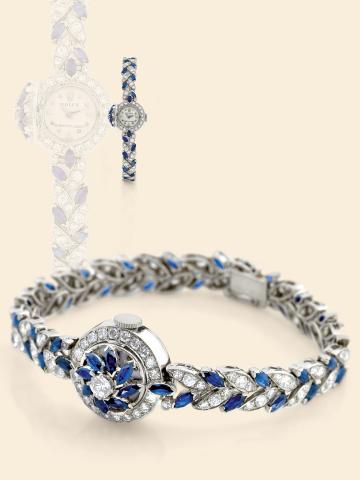 Platinum and Sapphires.Rolex, Ref. 9288. Made in the 1960s..Retailed by Serpico Y. Laino..Very fine and unusual, platinum, diamond and sapphire-set.lady's bracelet watch with concealed dial, and fancy.articulated platinum bracelet with leaf design, set wi