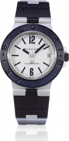 Aluminium.Bulgari, Aluminiun, movement.No. 39062, case No. L8573, Ref. AL 38 A..Made in 2000 circa..Fine, self-winding, center seconds, aluminum.wristwatch with date and a rubber strap with.an aluminum Bulgari buckle..To be sold without reserve