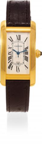 Yellow Gold Tank Americaine.Cartier, Paris, Tank Americaine, Automatic, case No. 777133CD, Ref. 2483. Made in the 1990s..Fine, rectangular curved, self-winding, water-resistant, 18K yellow gold wristwatch with date and an 18K yellow gold Cartier.buckle. A