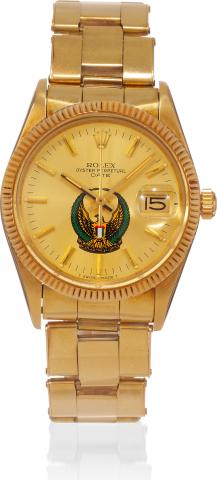 Ref. 15037, United Arab Emirate Crest.Rolex, Oyster Perpetual Date, movement No..0970891, case No. 6706819, Ref. 15037/15000. Made in 1981..Fine and rare, center seconds, water-resistant, 14K yellow gold.wristwatch with date and a 14K yellow gold riveted 