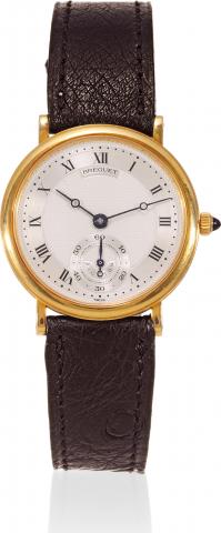 Breguet, Ref. 3889. Made in the 1990s..Very fine, thin, 18K yellow gold mid-sized wristwatch.with an 18K yellow gold Breguet buckle.
