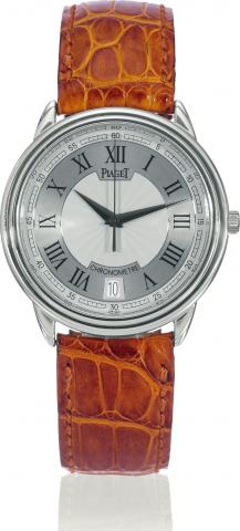 Chronometer.Piaget, Chronometre, No. 1267.case No. 804369, Ref. 15469. Sold on May.29, 2000..Fine, self-winding, water-resistant, 18K.white gold chronometer wristwatch with.date, center-seconds and a Piaget 18K.white gold buckle. Accompanied by a.Piaget c