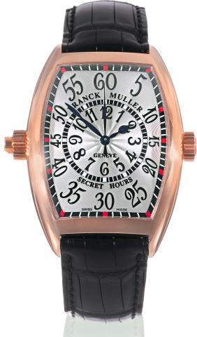 Secret Hours.Franck Muller, Geneve, Master of Complications.Secret Hours, No. 84, Ref. 7880 SE H II. Sold on July 10, 2007..Very fine and unusual, large, curved tonneau-shaped, selfwinding.water-resistant, 18K pink gold wristwatch with two.crowns, center-