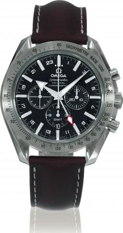 Broad Arrow GMT, Black Dial.Omega, Speedmaster Co-Axial Chronometer, GMT, case No. 78082016, Ref. 35815000. Sold on April 24, 2006..Fine, water-resistant, self-winding, two-time zone, stainless steel wristwatch with round button chronograph, registers.tac