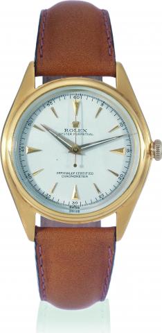 Yellow Gold, Ref 5028.Rolex, OysterPerpetual, Officially.Certified Chronometer, case No..675102, Ref. 5028. Made in 1950..Fine, tonneau-shaped, center-seconds.water-resistant, self-winding, 18K yellow.gold wristwatch with a gold-plated Rolex.buckle. Accom