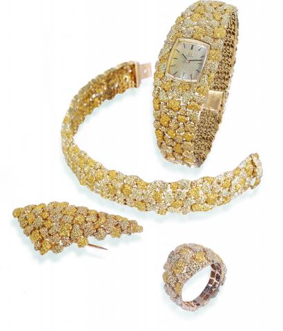 Rocaille d'Or.Omega, No. 21167585, case No. 674723, Ref. 8110/A.536/A.504/A484. Made circa 1969..Fine, rare and elegant, 18K gold lady's suite by Gilbert Albert, comprising: a wristwatch, a ring, a brooch and a bracelet, all with.nugget decoration.