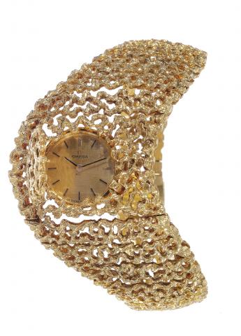 Arabesque d'Or Suite.Omega, No. 25974483, case No. A76965, Ref. 711.630/A.208/A.224. Made circa 1966..Fine, rare and elegant, 18K gold lady's suite by Gilbert Albert, comprising: a wristwatch, a bracelet and a necklace, all with vermicelli.decoration.