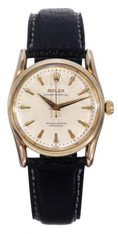 Ref. 6590, Bombay.Rolex, Oyster Perpetual, Officially Certified Chronometer.case No. 128291. Made in 1955..Fine and rare, center-seconds, self-winding, water-resistant, 14K.yellowgoldwristwatchwith honeycomb dial and an 18K yellowgold.Rolex buckle.