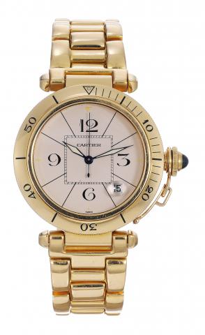 Yellow Gold Pasha.Cartier, Pasha, case No. 820907.Ref. 0505. Made in 1988..Fine, center seconds, self-winding, waterresistant.18K yellow gold wristwatch with.date and an 18K yellowgold Cartier bracelet.with double deployant clasp.