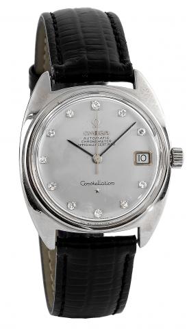White Gold Constellation.Omega, Constellation, Automatic Chronometer,Officially.Certified,No. 24284764, caseNo. 168009, Ref. 168017.Made circa.1966..Very fine, tonneau-shaped, center seconds, self-winding, waterresistant.18K white gold and diamond wristwa