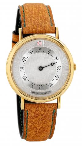 Breguet, Souscription,No. 30/50, Ref. 4705. Produced.in1989 in a limited edition of 50 pieces..Very fine and rare, jump-hour, self-winding, 18K yellow gold wristwatch..Accompanied by the original certificate and instruction.manual.