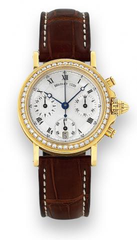 Chronograph.Breguet, No. 7339, Ref. 8490. Made in the 1990s..Very fine and rare, self-winding, water-resistant, 18K yellow.gold and diamond mid-size wristwatch with round button.chronograph, registers, date and an 18K yellow gold Breguet.deployant clasp. 