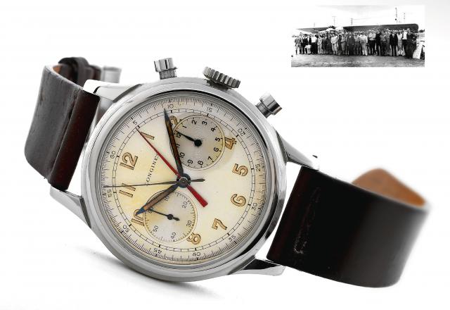 Chronograph _ Central Minute Register.Longines, No. 6989703, Ref. No. 23086, No. 415. Made circa 1945..Fine and rare, large, stainless steel wristwatch with chronograph, 12-hour register and red central progressive minute.register hand.