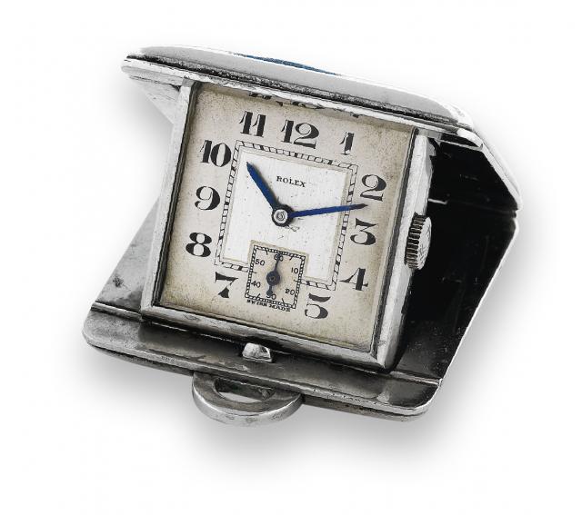 Ref. 3011.Rolex, Geneve, No. 378, case No. 034291, Ref..3011..An unusual and rare sprung metal purse watch with concealed.dial opening as a desk timepiece.