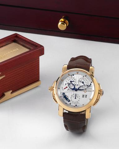 Sonata Dual Time.Ulysse Nardin, Sonata Dual Time, No. 113, Ref. 660-88. Made circa 2004. Production of this reference started.in 2003..Very fine, rare and unusual, large, center seconds, two crowns, self-winding, water-resistant, two time zone, 18K yellow