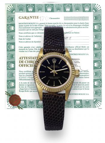 Rolex, Oyster Perpetual, Superlative Chronometer Officially Certified, case No. T327706, Ref. 67198. Made in.1997, sold on July 16, 2001..Fine, center-seconds, self-winding, water-resistant, 18K yellow gold lady's wristwatch with an 18K yellow gold-plated