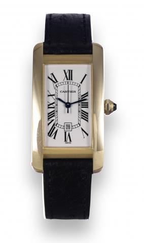 Tank Americaine.Cartier, Tank Americaine, Automatic, case No. 777133CD, Ref. 2483. Made in the 1990's..Fine, rectangular curved, center seconds, self-winding, water-resistant, 18K yellow gold wristwatch with date and an 18K.yellow gold Cartier buckle. Acc
