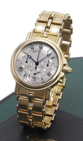 Chronographe Automatique.Breguet, Horloger de la Marine, Chronographe Automatique, No. 1786. Made in.the 1990's..Very fine, self-winding, water-resistant, 18K yellow gold wristwatch with round button chronograph.registers, date and an 18K yellow gold Breg