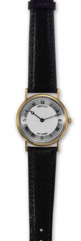 Breguet, No. 3595 K, Ref. 3500. Made circa 2000..Fine and elegant, thin, 18K yellow gold wristwatch.with an 18K yellow gold Breguet buckle. Accompanied by a.fitted box.