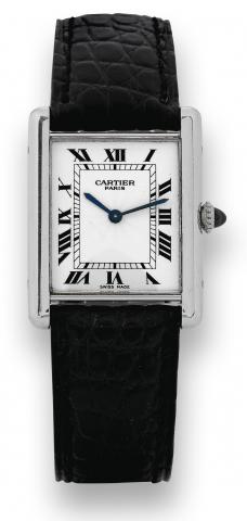 Platinum Tank M_canique.Cartier, Paris, Tank, case No. C129787, Ref. 1601. Made in the 1980s..Very fine and elegant, rectangular, thin, platinum wristwatch with an 18K white gold Cartier deployant clasp. Accompanied.by the original warranty and instructio