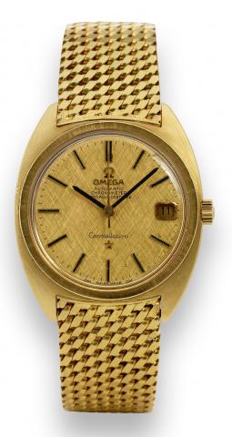 Yellow Gold Constellation.Omega, Constellation, Automatic, Chronometer.Officially Certified, No. 25992738, Ref. 168.009/168.017..Made circa 1967..Very fine, tonneau-shaped, center seconds, self-winding.water-resistant, 18K yellow gold wristwatch with date
