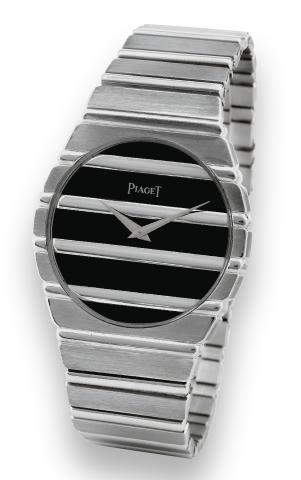 Piaget, Polo, No. 345920, Ref. 7661 C 701..Made in the 1980s..Fine, tonneau-shaped, water-resistant, 18K white gold.quartz wristwatch with an 18K white gold integral Piaget.link bracelet.