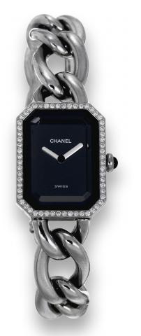 Chanel, Paris, Ref. P.G. 55110..Made circa 1987..Fine and elegant, rectangular, stainless.steel and diamond-set lady's quartz.wristwatch with an integral stainless.steel Chanel chain-link bracelet..To be sold without reserve