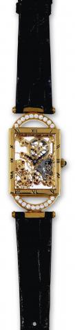 Armin Strom, No. 076. Made in the 1980s..Fine and unusual, rectangular, skeletonized.18K yellow gold and diamond wristwatch with an 18K gold.buckle.