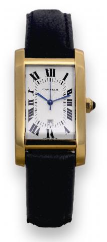 Tank Am_ricaine.Cartier, Tank Am_ricaine.Automatic, case No. 8172984, Ref..00939. Made in the 1990s..Fine, rectangular curved, centerseconds.self-winding, water-resistant.18K yellow gold wristwatch with.date and an 18K yellow gold Cartier.deployant clasp.