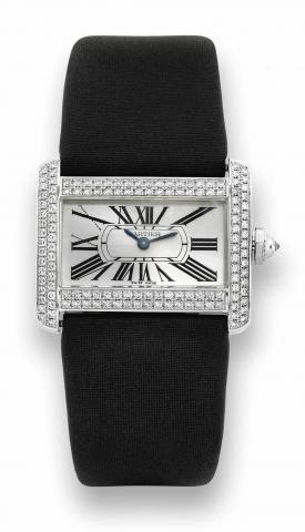 White Gold Tank Divan.Cartier, Tank Divan, case No. 26510CE, Ref. 2613..Made circa 2006..Fine and unusual, horizontal rectangular and curved, waterresistant.18K white gold and diamond-set lady