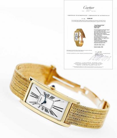 Large Elongated Tank.Cartier, London, Elongated Tank, movement.made by Jaeger LeCoultre, case No. 10393, Ref. 8088. Made.in 1966..Very fine and rare, rectangular curved, 18K yellow gold wristwatch.with an 18K yellow gold herringbone textured mesh.bracelet