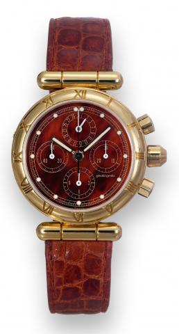 Gerald Genta, Gefica, Chronograph.movement No..4296537, case No. 43650.Ref. G3131.7. Made in the 1990's..Fine, self-winding, water-resistant, 18K.yellow gold wristwatch with round.button chronograph, registers, date.and an 18K yellow gold G_rald Genta.buc