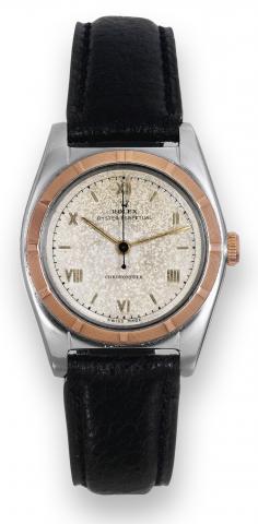 Rolex, Oyster Perpetual, Chronometer, case.No. 608098, Ref. 4919. Made in 1948..Fine and rare, tonneau-shaped, center-seconds, self-winding.water-resistant, stainless steel and pink gold wristwatch..To be sold without reserve