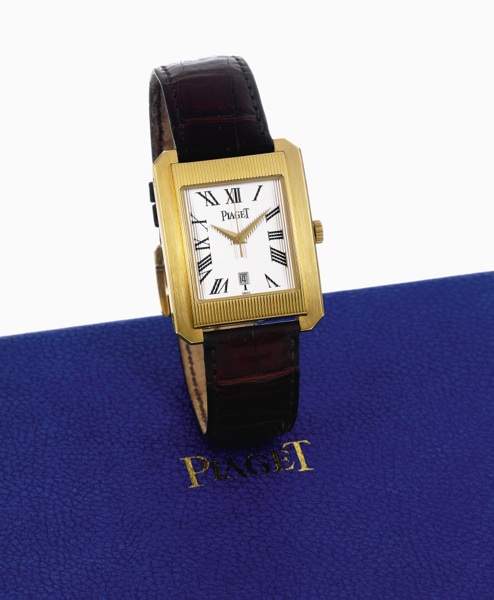 Protocole XL.Piaget Protocole XL, Automatic, case No. 862239.Ref. 26100. Made circa 2004..Fine, water-resistant, self-winding, center seconds, 18K yellow.gold wristwatch with date and 18K yellow gold Piaget buckle..Accompanied by a fitted box, pouch and b