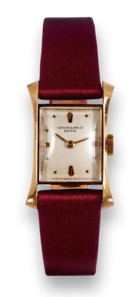 Yellow Gold Ref. 2261.Patek Philippe Co, Geneve, movement No..943665, case No. 649939, Ref. 2261. Made in 1949, sold on September 21st, 1949..Fine, elegant and rare, rectangular flared, 18K yellow gold lady's.wristwatch with an 18K yellow gold Patek Phi