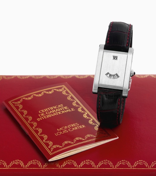 Cartier's Anniversary.Cartier, Paris, Tank a guichet, No. 070/150. Made in a limited edition of 150 pieces to celebrate the 150th.anniversary of Cartier in 1997..Very fine, very rare and elegant, rectangular, platinum digital wristwatch with an 18K white 