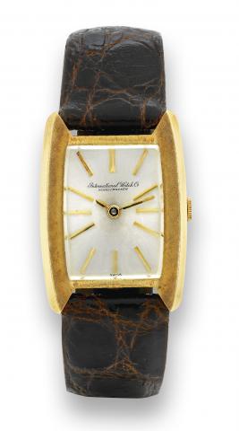 Ref. 1311 Yellow Gold.International Watch Co., Schaffhausen, No. 1288790, case No. 1687770, Ref. 1311. Made in the 1970's..Fine and rare, tonneau-shaped, 18K yellow gold wristwatch with an 18K yellow gold buckle. Accompanied by a fitted box.