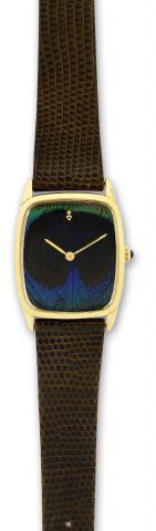 Corum.Corum, No. 109668, case No. 140266, Ref. 57187..Made in the 1980's..Fine and unusual, rectangular, 18K yellow gold wristwatch.with a cloth dial.
