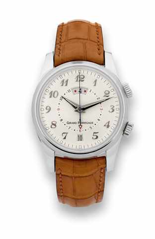 Girard-Perregaux Ref. 4935 -.Two Time Zone _ Alarm.Girard-Perregaux, Ref. 4935, No. 65. Made circa 2000..Very fine, self-winding, water-resistant, two time zone, stainless.steel wristwatch with date, alarm and a steel Girard- Perregaux.buckle. Accompanied