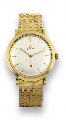 Omega yellow gold.wristwatch.Omega, movement No. 14430564.case No. 11408414, Ref. 14357. Sold on.August 28th, 1956..Fine and rare, 18K yellow gold.wristwatch with an 18K yellow gold mesh.bracelet. Accompanied by the original.warranty and fitted box.
