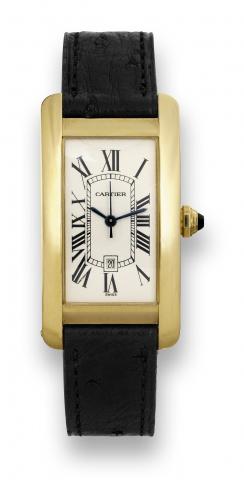 Cartier Tank Americaine.Cartier, Tank Americaine, Automatic, case No. 777133CD.Ref. 2483. Made in the 1990's..Fine, rectangular curved, center seconds, self-winding, waterresistant.18K yellow gold wristwatch with date and an 18K.yellow gold Cartier buckle
