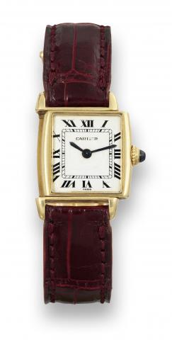 Cartier R_versible.Cartier, Paris, R_versible, case No. 032141. Made in the.1980's..Fine and rare, rectangular, 18K yellow gold reversible.wristwatch with an 18K yellow gold Cartier deployant clasp.