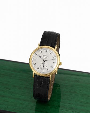 Breguet yellow gold.Breguet, No. 4979, Ref. 3910. Sold on October, 1997..Very fine and elegant, 18K yellow gold wristwatch with an.18K yellow gold Breguet buckle. Accompanied by a fitted.box and certificate.