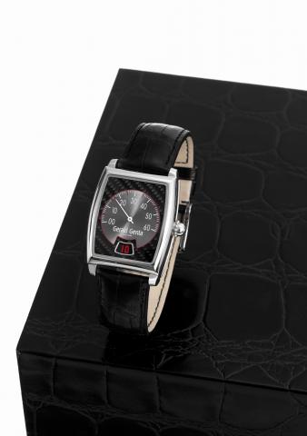G_rald Genta R_tro Solo.G_rald Genta, R_tro Solo, Ref. R.S.O.M.10. Made circa.2000..Fine, tonneau-shaped and curved, jump-hour, self-winding.water-resistant, stainless steel wristwatch with retrograde.minutes and a stainless steel G_rald Genta buckle..Acc