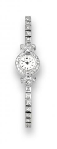 Longines White Gold.Diamonds.Longines, movement No. 9846193, case.No. 355887, Ref. 599. Made circa 1950..Fine and elegant, 18K white gold and.diamond-set lady's wristwatch with an.integral 14K white gold and diamond-set.bracelet..To be sold without reserv