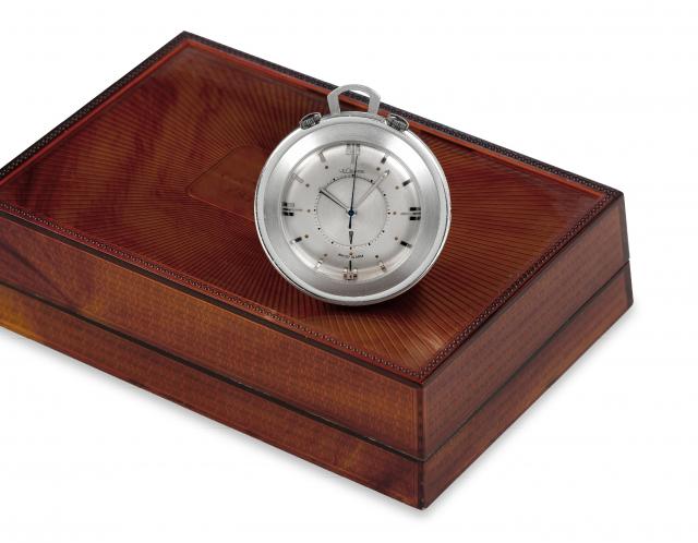 LeCoultre Memovox.LeCoultre Memovox, Wrist Alarm, No. 1057830. Made in the.1960's..Fine, center-seconds, stainless steel travel pocket watch with.alarm and 2 crowns. Accompanied by the original fitted box..Property of a French Gentleman