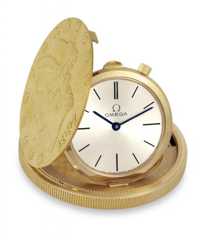 Omega Double Eagle.Omega, No. 25909180, Ref. BA 111.1707..Made in 300 examples in 1965..Very fine and rare, extra-thin, 22K yellow gold.keyless dress watch set in a U.S. 20 Dollar.double eagle coin of 1897.