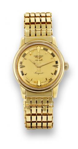 Longines Conquest.Longines, Conquest Automatic.movement No. 9969696, case No. 396.Ref. 9001 21. Made in the 1950s..Fine, center-seconds, self-winding, waterresistant.18K yellow gold wristwatch.with the original 18K yellow gold.Longines link bracelet..To b