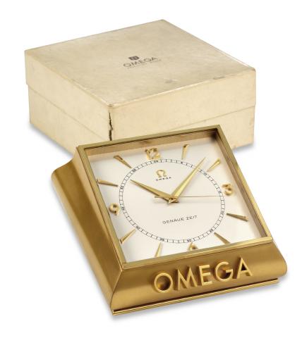 Omega, Bienne, Genaue Zeit.No. 716237, Ref. 5008. Made in 1954..Very fine and rare, bronzed, 100-hour, Genaue.Zeit Deluxe, center-seconds, window.presentation, keyless, chronometer table clock.with high precision caliber. Accompanied by the.original fitte